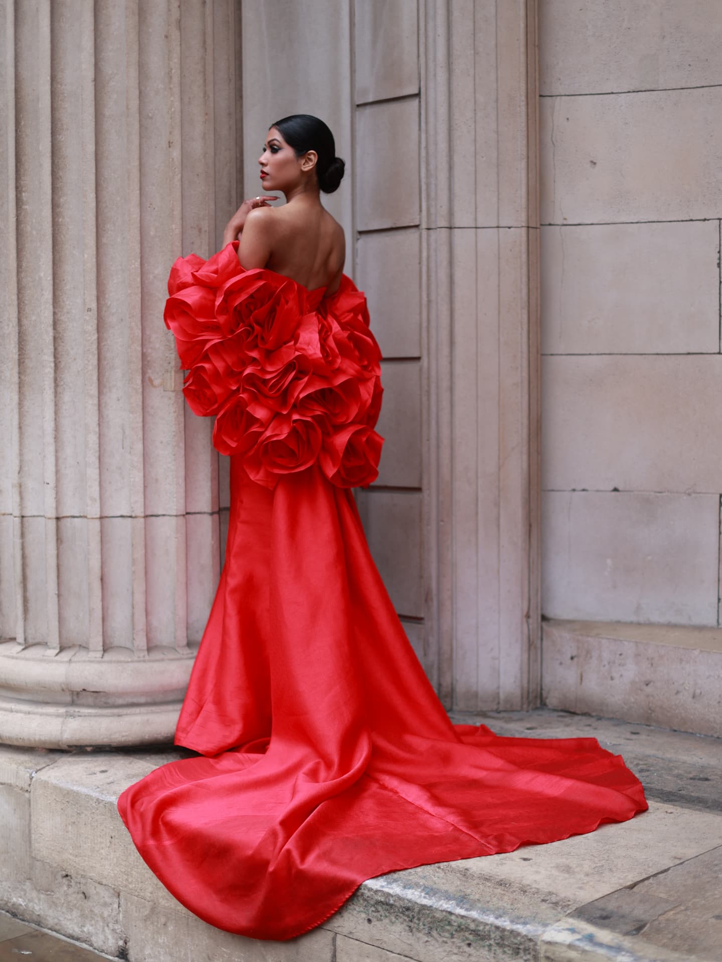 London makeup artist Dorota Wojcik — editorial beauty with a sleek chignon and true red lip, red couture gown